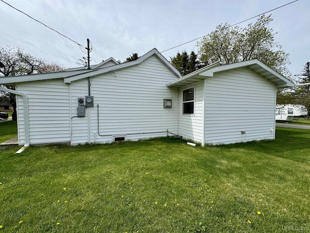 7848 Cole St, Rapid River, MI 49878 - view of side of property featuring a yard