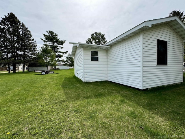 7848 Cole St, Rapid River, MI 49878 - view of side of home featuring a yard