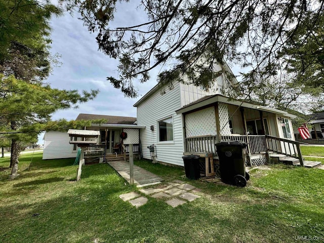 7848 Cole St, Rapid River, MI 49878 - back of house with a yard