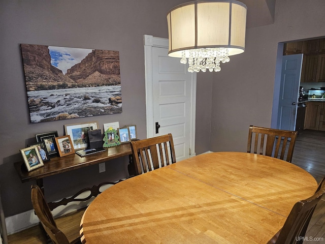 968 Baldwin Ave, Negaunee, MI 49866 - dining room featuring wood finished floors, an office area, and a chandelier