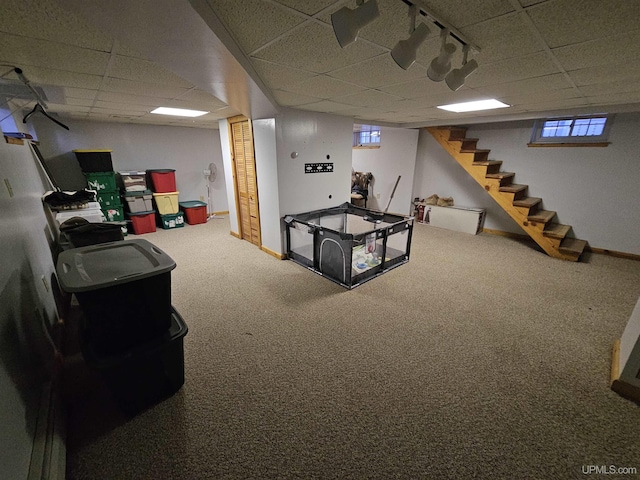 968 Baldwin Ave, Negaunee, MI 49866 - basement featuring a paneled ceiling, stairway, and carpet floors