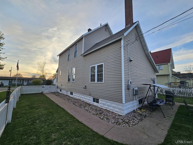 968 Baldwin Ave, Negaunee, MI 49866 - property exterior at dusk featuring a chimney