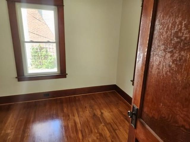 2515 Cooper St, Saginaw, MI 48602 - spare room featuring healthy amount of natural light, wood finished floors, and baseboards