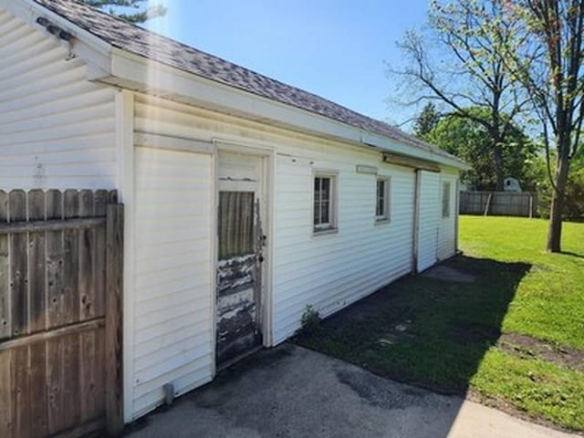 2515 Cooper St, Saginaw, MI 48602 - view of side of property featuring a shingled roof