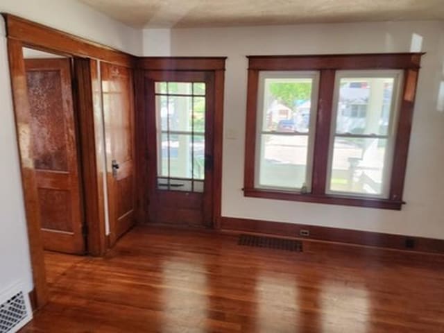 2515 Cooper St, Saginaw, MI 48602 - entryway featuring wood finished floors and baseboards