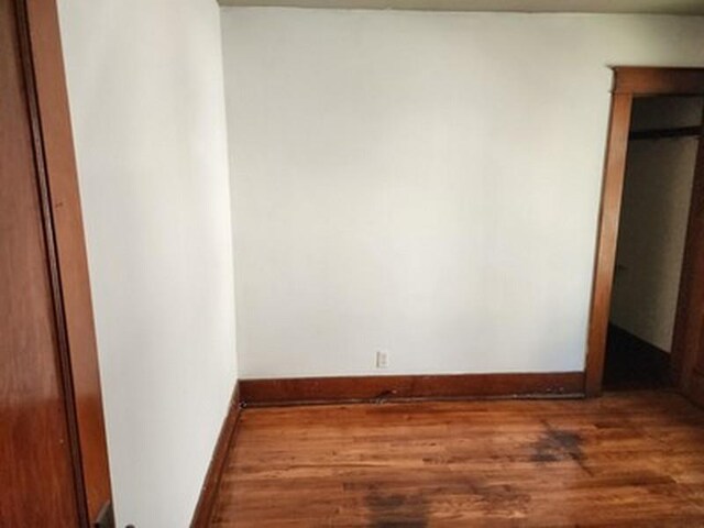 2515 Cooper St, Saginaw, MI 48602 - unfurnished bedroom featuring wood finished floors and baseboards