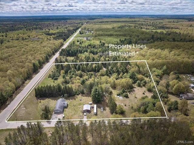 4815 N Southside Rd, Manistique, MI 49854 - aerial overview of property's location featuring a heavily wooded area and property boundaries highlighted