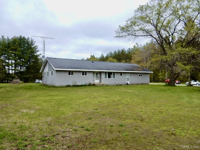 4815 N Southside Rd, Manistique, MI 49854 - rear view of property with a yard