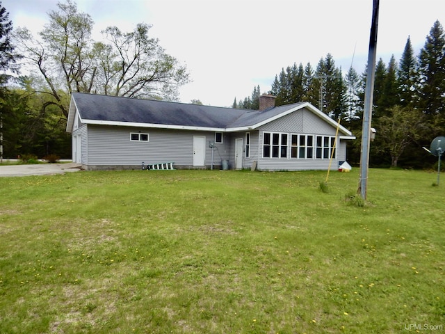 4815 N Southside Rd, Manistique, MI 49854 - view of front of house with a chimney and a front yard