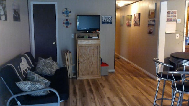 4158 Scott Ct, Gladwin, MI 48624 - living room featuring wood finished floors and baseboards