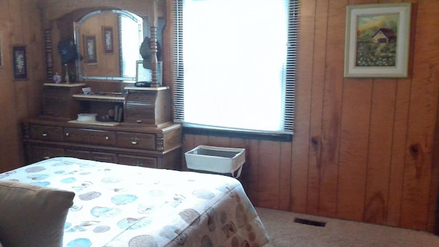 4158 Scott Ct, Gladwin, MI 48624 - carpeted bedroom with wooden walls and multiple windows