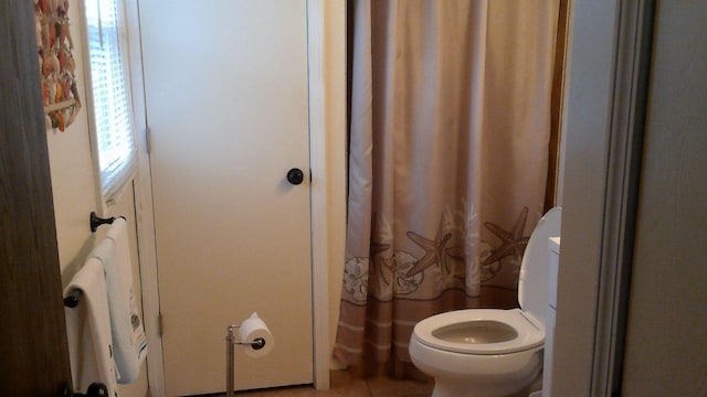 4158 Scott Ct, Gladwin, MI 48624 - bathroom with toilet, a shower with curtain, and tile patterned flooring