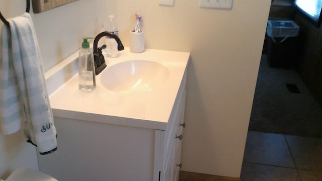 4158 Scott Ct, Gladwin, MI 48624 - bathroom with vanity, toilet, and tile patterned floors