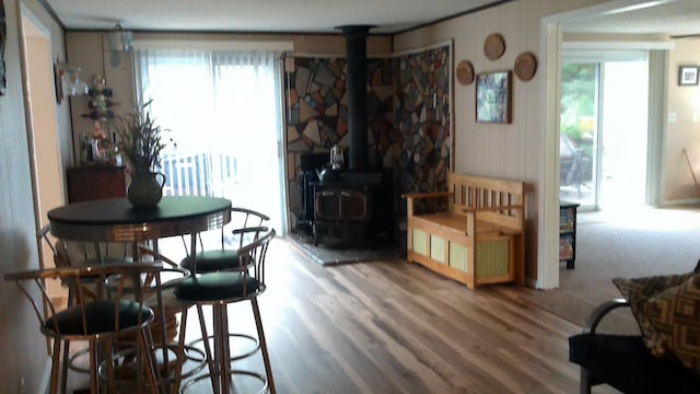 4158 Scott Ct, Gladwin, MI 48624 - dining area with wood finished floors and a wood stove