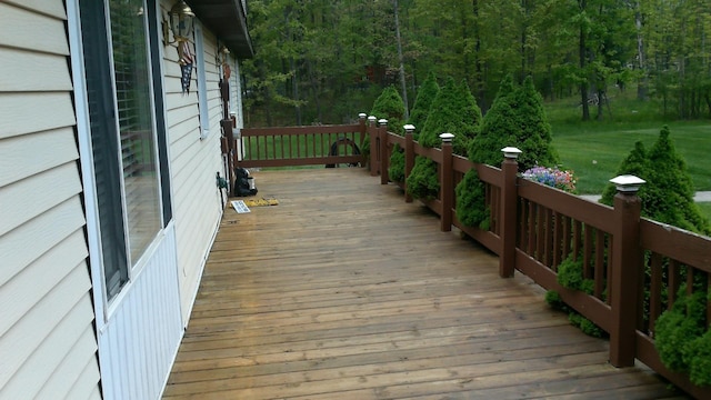 4158 Scott Ct, Gladwin, MI 48624 - wooden terrace with a view of trees