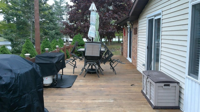 4158 Scott Ct, Gladwin, MI 48624 - deck with outdoor dining space and area for grilling