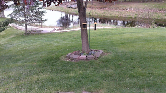 4158 Scott Ct, Gladwin, MI 48624 - view of green lawn featuring a water view