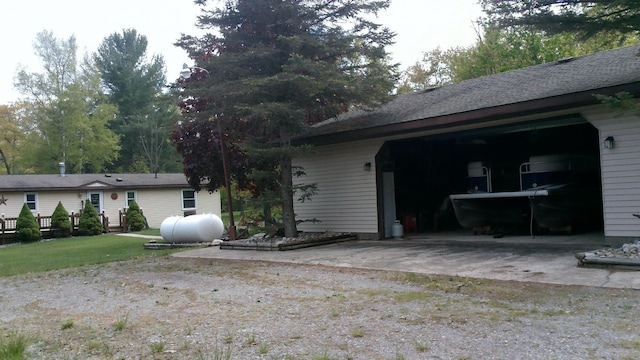 4158 Scott Ct, Gladwin, MI 48624 - view of side of property with a garage