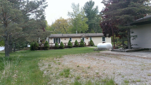 4158 Scott Ct, Gladwin, MI 48624 - back of house with a wooden deck and a yard