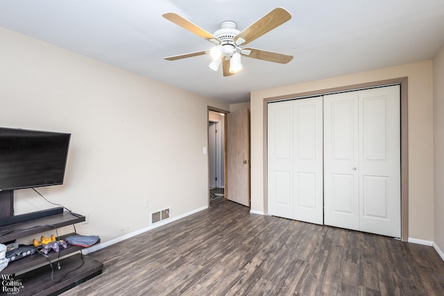 656 Lawson Dr, Lake Orion, MI 48362 - unfurnished bedroom featuring wood finished floors, baseboards, a closet, and a ceiling fan