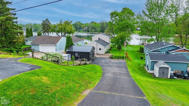 656 Lawson Dr, Lake Orion, MI 48362 - view of asphalt driveway featuring a water view