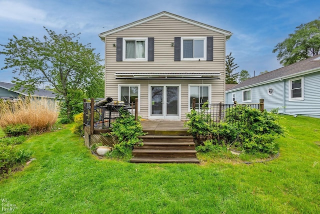 656 Lawson Dr, Lake Orion, MI 48362 - back of property with a wooden deck and a lawn