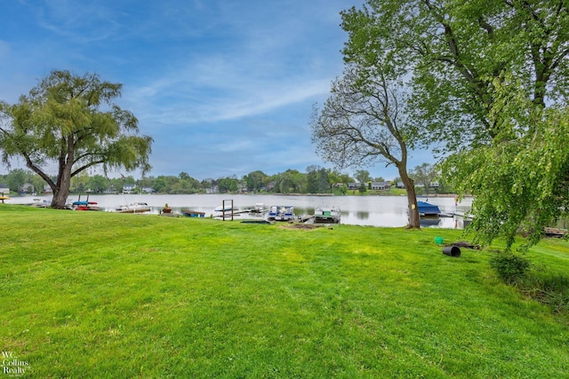 656 Lawson Dr, Lake Orion, MI 48362 - view of grassy yard featuring a water view and a boat dock