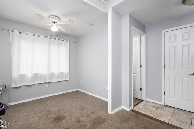 656 Lawson Dr, Lake Orion, MI 48362 - unfurnished bedroom featuring carpet floors, baseboards, and a ceiling fan