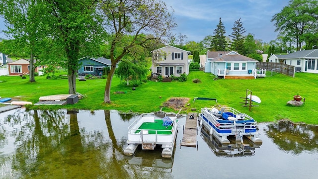 656 Lawson Dr, Lake Orion, MI 48362 - dock area featuring a residential view, a yard, boat lift, and a deck with water view