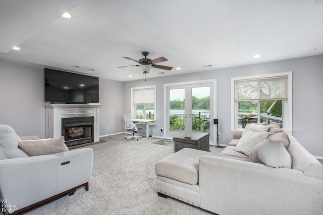 656 Lawson Dr, Lake Orion, MI 48362 - living area featuring a fireplace with flush hearth, recessed lighting, carpet flooring, ceiling fan, and baseboards