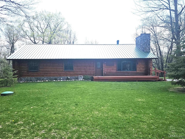 2051 Town Rd M Rd, Florence T-Wi, WI 54121 - back of property featuring a chimney, log exterior, metal roof, and a lawn