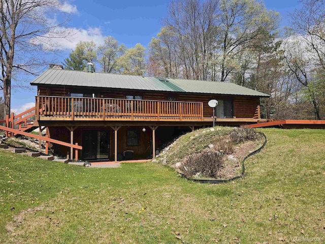 2051 Town Rd M Rd, Florence T-Wi, WI 54121 - rear view of property featuring a wooden deck, log siding, a lawn, and metal roof