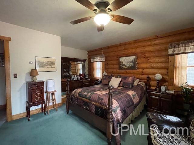 2051 Town Rd M Rd, Florence T-Wi, WI 54121 - bedroom featuring rustic walls, carpet, baseboards, and a ceiling fan