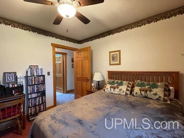 2051 Town Rd M Rd, Florence T-Wi, WI 54121 - bedroom with ceiling fan and carpet floors