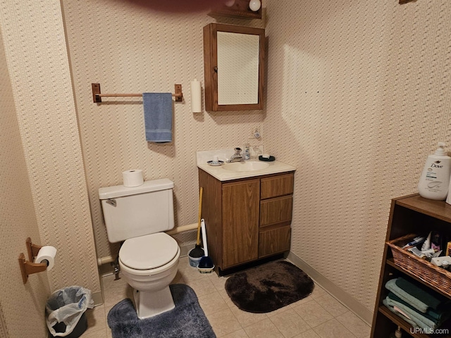 2051 Town Rd M Rd, Florence T-Wi, WI 54121 - bathroom with toilet, vanity, tile patterned flooring, baseboards, and wallpapered walls