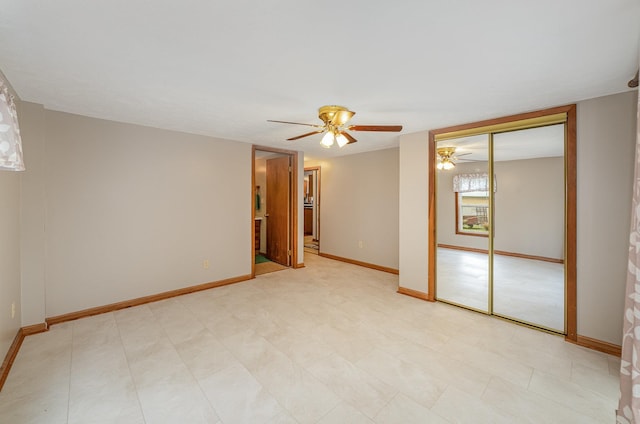 122 Shady Grove Ln, Roscommon, MI 48653 - spare room featuring a ceiling fan and baseboards