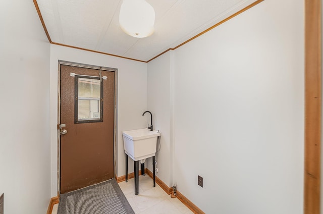 122 Shady Grove Ln, Roscommon, MI 48653 - laundry area featuring crown molding, baseboards, and light tile patterned floors