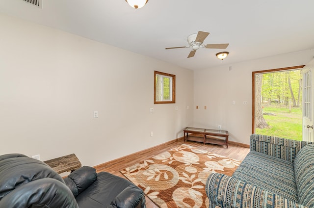 122 Shady Grove Ln, Roscommon, MI 48653 - living area featuring light wood finished floors, healthy amount of natural light, and ceiling fan