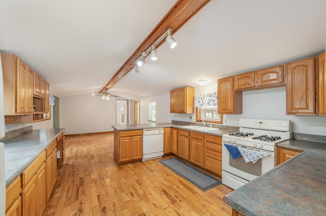 122 Shady Grove Ln, Roscommon, MI 48653 - kitchen with white appliances, a peninsula, rail lighting, a sink, and light wood-type flooring