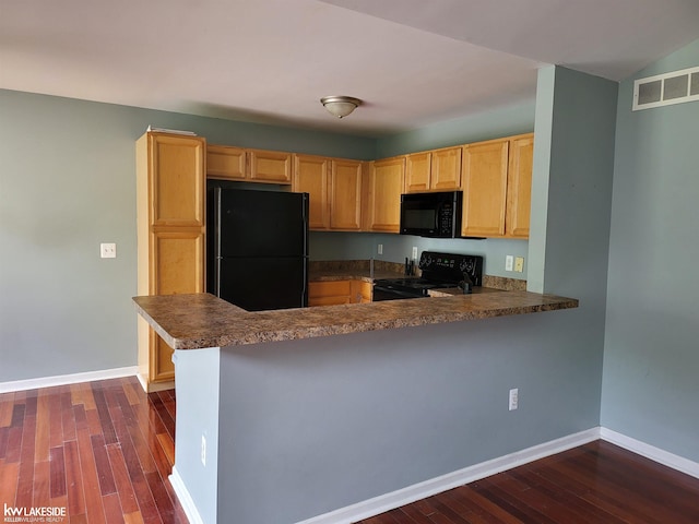 15495 Cornell Dr, Clinton Township, MI 48038 - kitchen featuring black appliances, dark countertops, dark wood finished floors, and baseboards