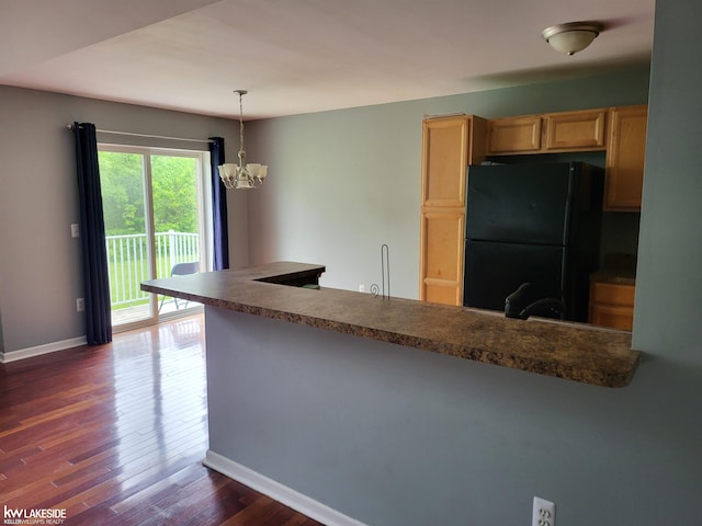 15495 Cornell Dr, Clinton Township, MI 48038 - kitchen with freestanding refrigerator, baseboards, dark wood-style floors, light brown cabinets, and dark countertops