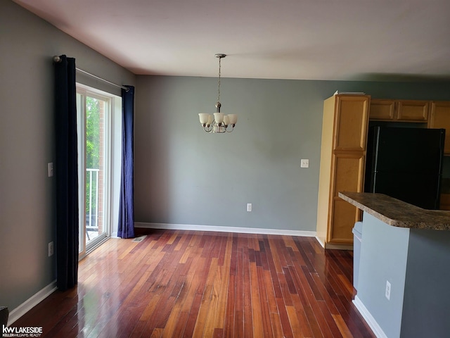 15495 Cornell Dr, Clinton Township, MI 48038 - unfurnished dining area featuring a chandelier, dark wood-style flooring, and baseboards