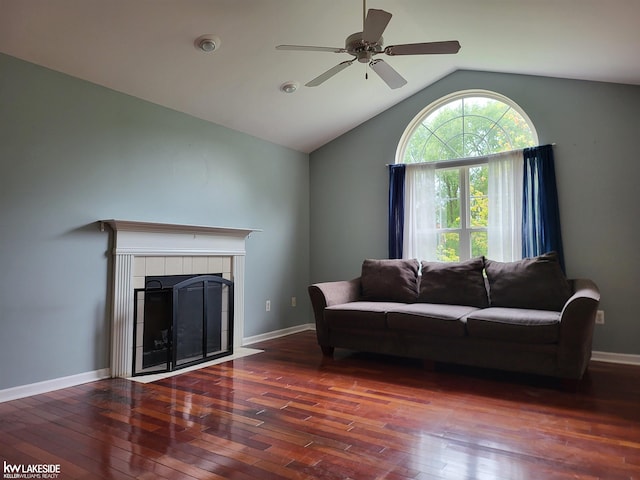 15495 Cornell Dr, Clinton Township, MI 48038 - living area with a ceiling fan, hardwood / wood-style floors, vaulted ceiling, a tiled fireplace, and baseboards