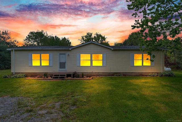 2100 Rowe Rd, Applegate, MI 48401 - back of house at dusk featuring a yard and crawl space