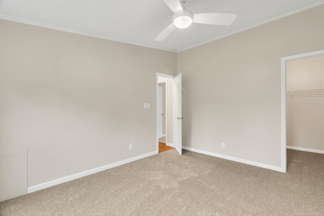 2100 Rowe Rd, Applegate, MI 48401 - unfurnished bedroom with carpet, ornamental molding, a walk in closet, a closet, and baseboards