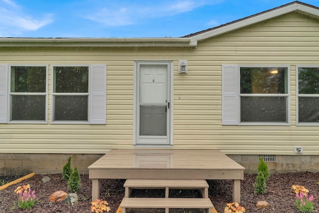 2100 Rowe Rd, Applegate, MI 48401 - doorway to property featuring a wooden deck and crawl space