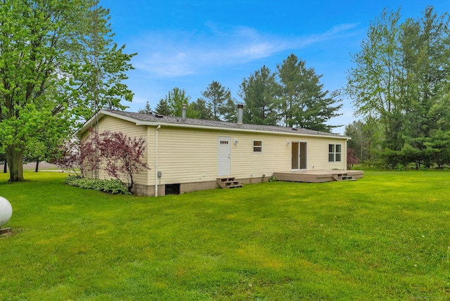 2100 Rowe Rd, Applegate, MI 48401 - back of property with entry steps, a wooden deck, and a lawn
