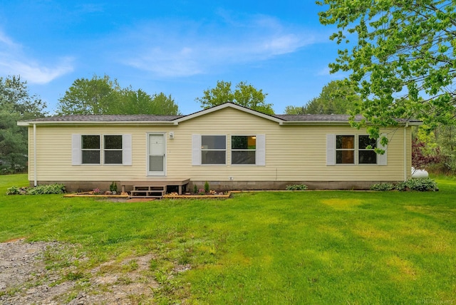 2100 Rowe Rd, Applegate, MI 48401 - back of house featuring crawl space, a lawn, and a shingled roof