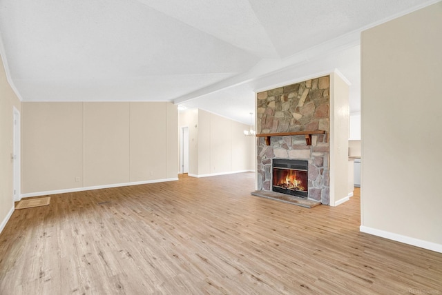 2100 Rowe Rd, Applegate, MI 48401 - unfurnished living room featuring light wood finished floors, crown molding, a stone fireplace, and baseboards