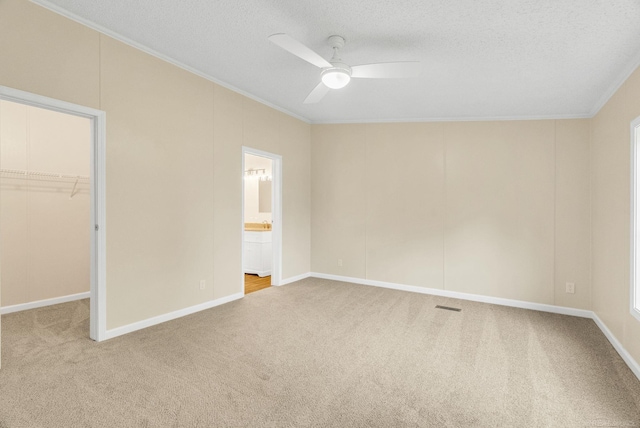 2100 Rowe Rd, Applegate, MI 48401 - unfurnished bedroom featuring ornamental molding, a spacious closet, carpet, a textured ceiling, and a closet